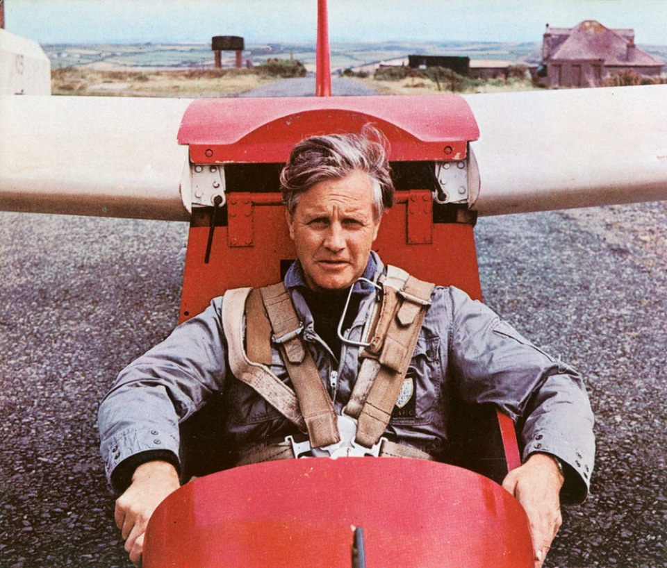 Man sitting in red glider