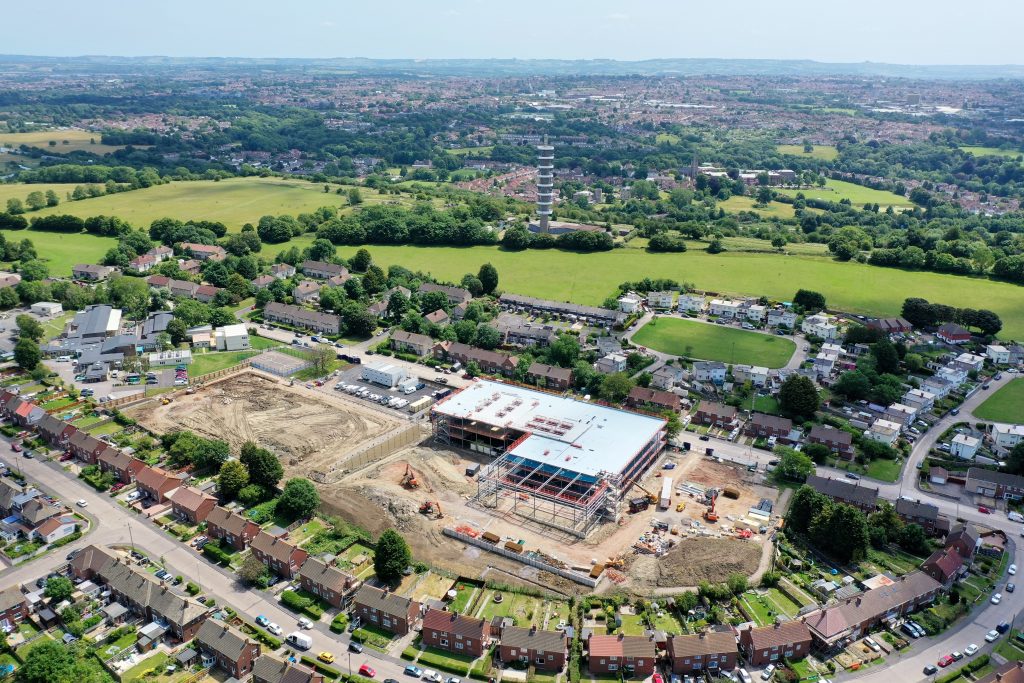 Trinity Academy Lockleaze, aerial view - midway through the build process. Purdown hill to the top of the image and housing around the rest of the site