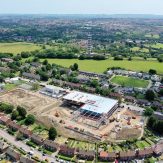 Trinity Academy Lockleaze, aerial view - midway through the build process. Purdown hill to the top of the image and housing around the rest of the site