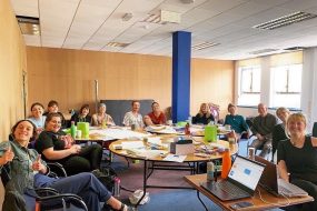 Large group co-working in one of St Anne's House's rooms to hire