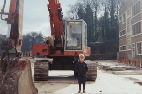 Young boy in front of digger at Boardmills, St Anne's 1983, courtesy of Rich Clark © Reg Clark